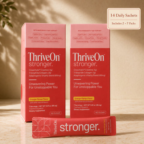 ThriveOn Stronger 14 Pack with two 7-pack boxes and one sachet on a warm marble surface